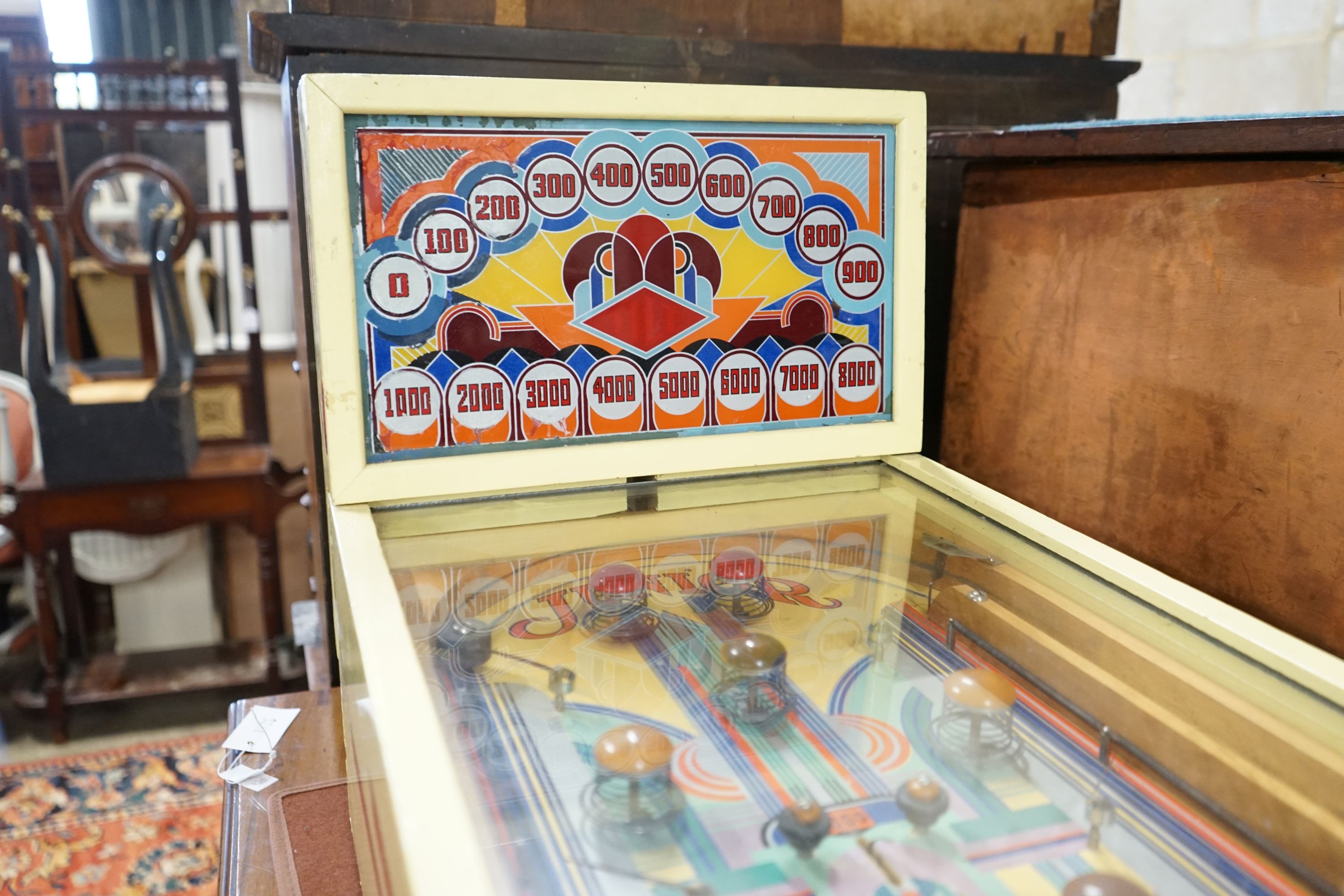 A vintage American 'Junior' pinball machine, width 39cm, length 72cm, height 45cm, ITEM ONLY A COLLECTOR'S ITEM - REWIRE REQUIRED BEFORE USE